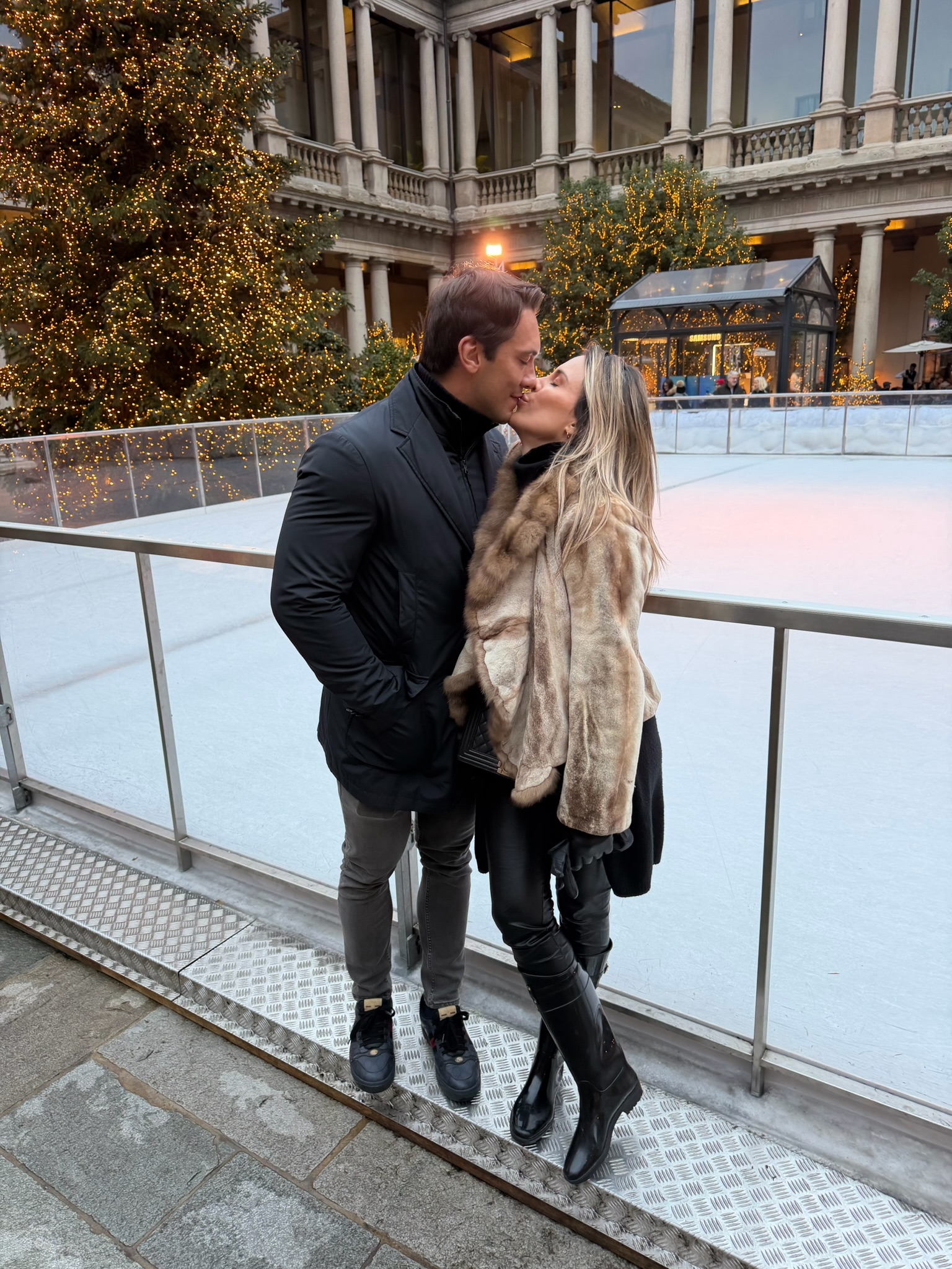 A kiss by the ice rink in Milan