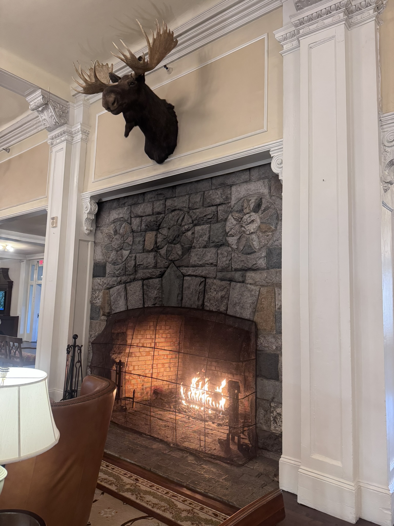 By the fireplace in the hotel lobby