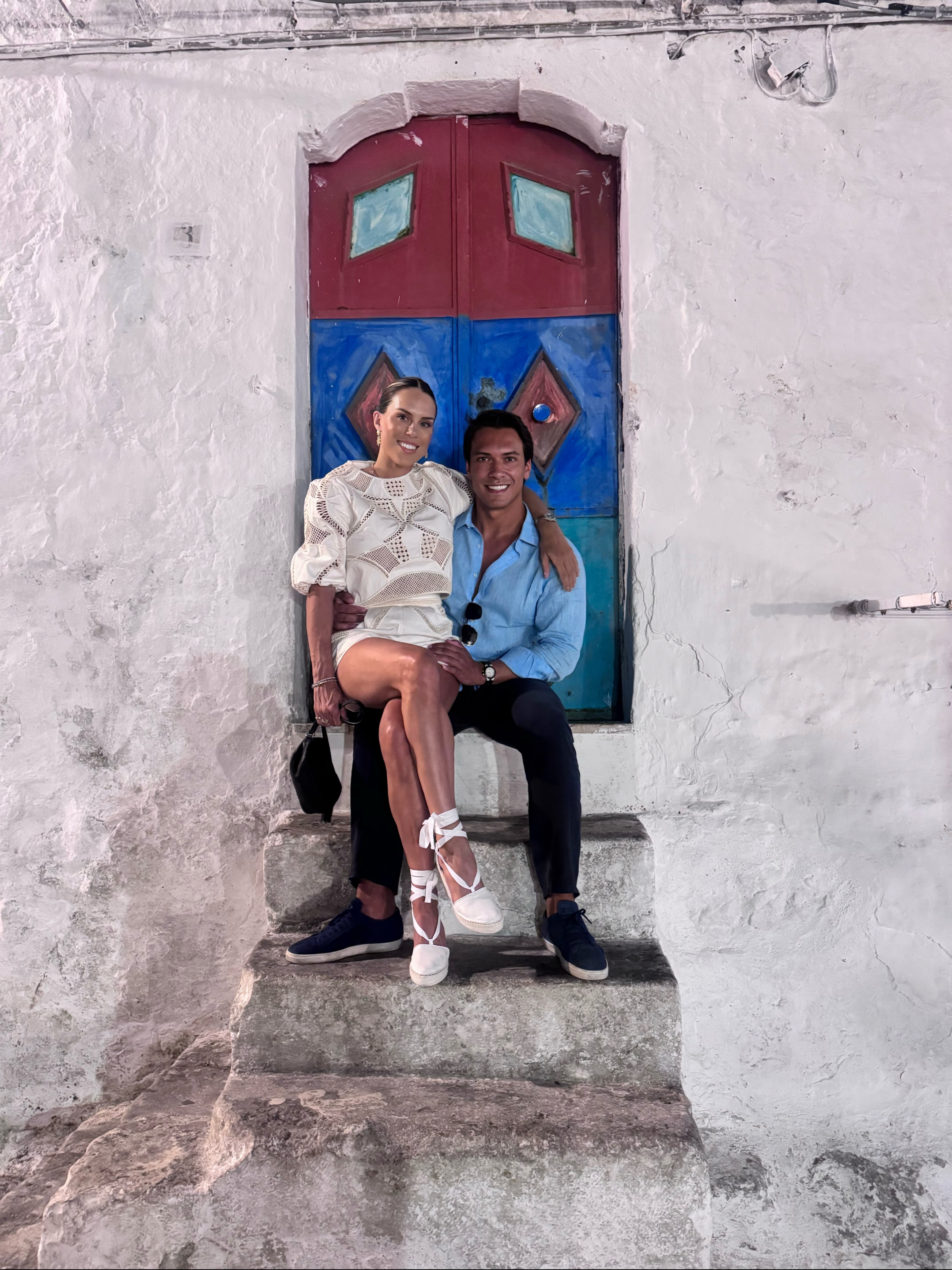A quiet moment in the Polignano doorway