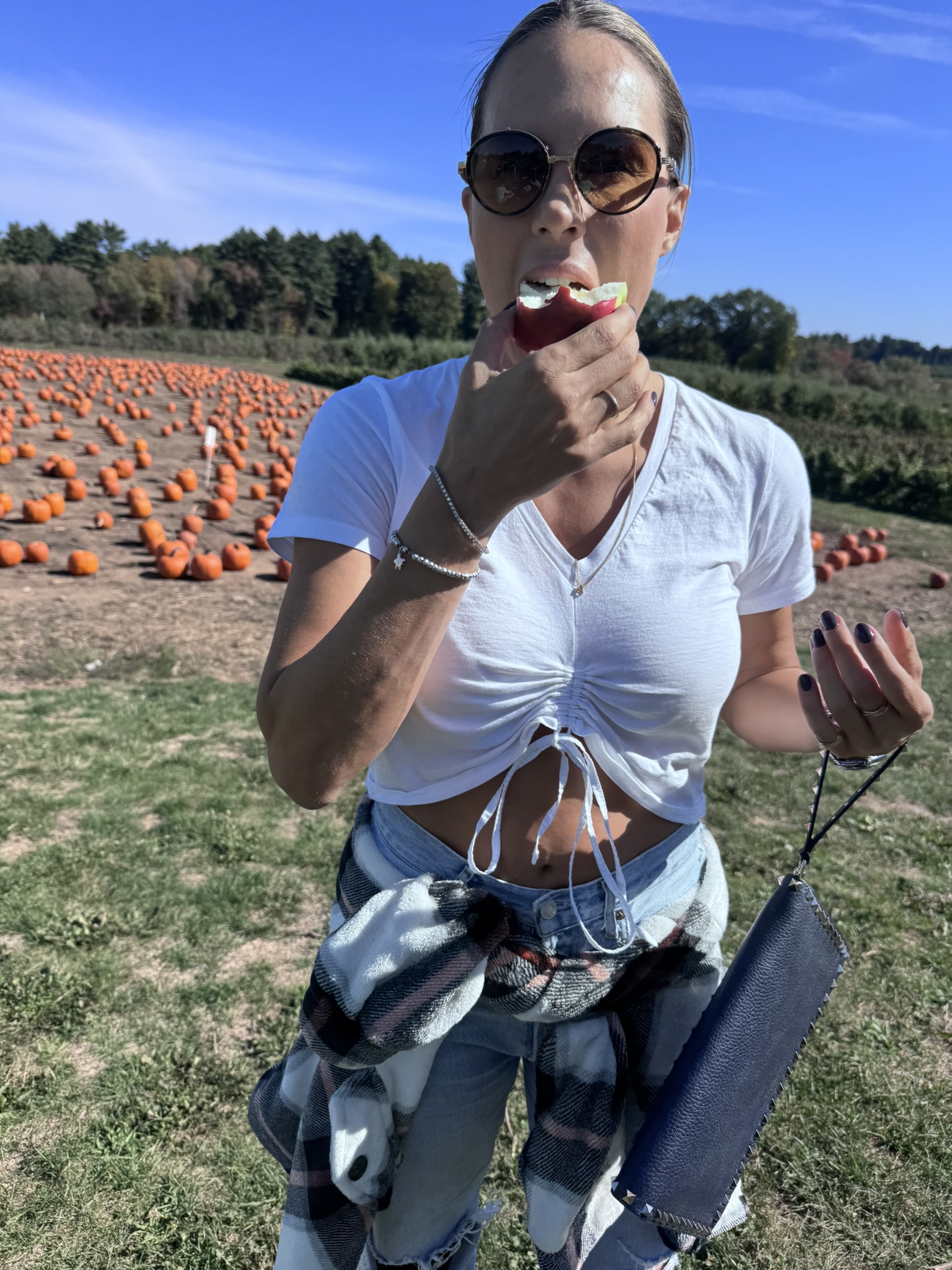 A bite of apple at the pumpkin patch